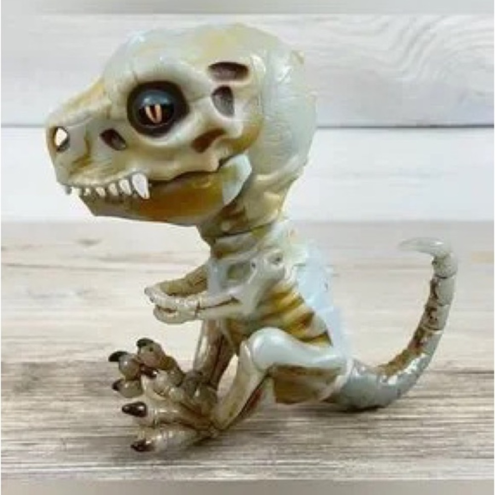 Bone-Accent Resin Dino Figurine in Pale Green and Brown